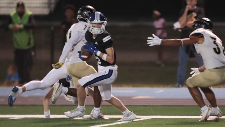 Washburn Rural senior makes a catch against Topeka High during the game at Washburn Rural High School on Oct. 3, 2025.