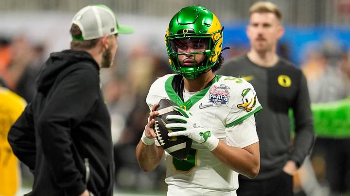 Jan 9, 2026; Atlanta, GA, USA; Oregon Ducks quarterback Dante Moore (5) warms up prior to the 2025 Peach Bowl and semifinal game of the College Football Playoff against the Oregon Ducks at Mercedes-Benz Stadium. Mandatory Credit: Dale Zanine-Imagn Images