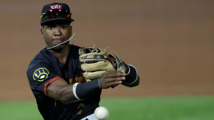 Wisconsin Timber Rattlers' Luis Pena (2) throws to first base against the Quad Cities River Bandits during their baseball game Wednesday, August 27, 2025, at Neuroscience Group Field at Fox Cities Stadium in Grand Chute, Wisconsin. Quad City won 9-5.