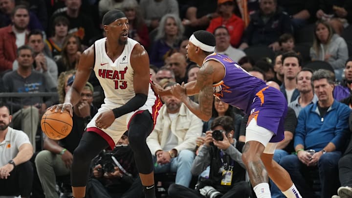 Nov 6, 2024; Phoenix, Arizona, USA; Miami Heat center Bam Adebayo (13) dribbles against Phoenix Suns guard Bradley Beal (3) during the first half at Footprint Center. Mandatory Credit: Joe Camporeale-Imagn Images