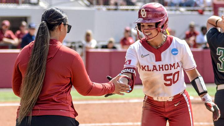 Oklahoma infielder Ailana Agbayani celebrates after reaching base in the NCAA Tournament at Love's Field. Oklahoma infielder Ailana Agbayani celebrates after reaching base in the NCAA Tournament at Love's Field.