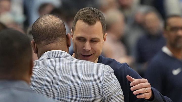 UNC basketball head coach Hubert Davis versus Duke