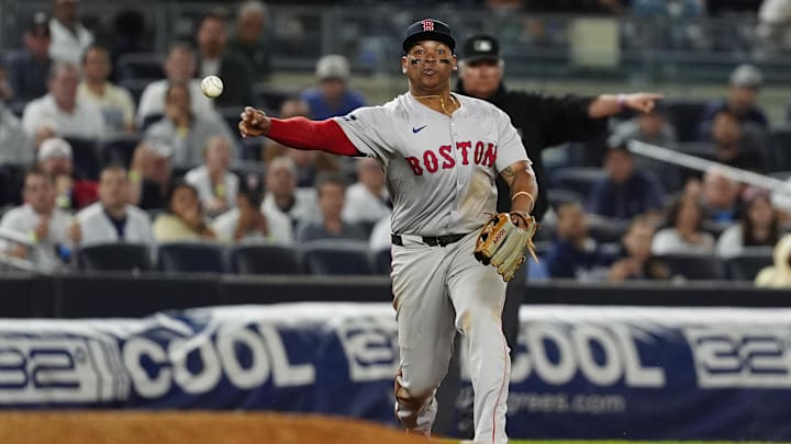 Sep 12, 2024; Bronx, New York, USA; Boston Red Sox third baseman Rafael Devers (11) throws out New York Yankees shortstop Anthony Volpe (not pictured) after fielding a ground ball during the ninth inning at Yankee Stadium. Mandatory Credit: Gregory Fisher-Imagn Images