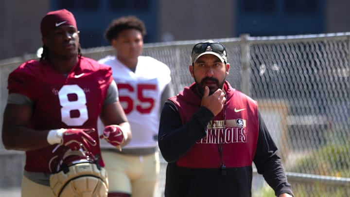 FSU football players and coaches walk into the first spring practice of the spring season on Wednesday, March 19, 2025