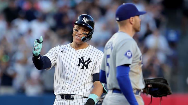 Jun 9, 2024; Bronx, New York, USA; New York Yankees right fielder Aaron Judge (99) reacts after his RBI double against the Los Angeles Dodgers during the third inning at Yankee Stadium.