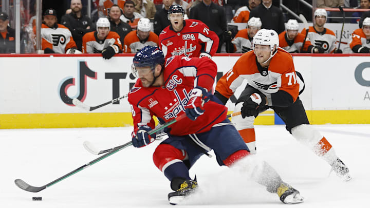 Oct 23, 2024; Washington, District of Columbia, USA; Washington Capitals left wing Alex Ovechkin (8) skates with the puck as Philadelphia Flyers right wing Tyson Foerster (71) chase in the first period at Capital One Arena. Mandatory Credit: Geoff Burke-Imagn Images
