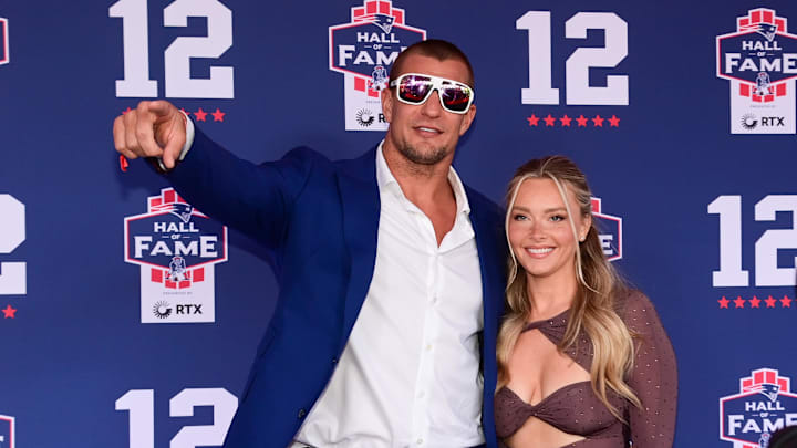 Jun 12, 2024; Foxborough, MA, USA; Retired NFL tight end Rob Gronkowski poses for photos with his girlfriend Camille Kostek during the New England Patriots Hall of Fame induction Ceremony for Tom Brady Mandatory Credit: Eric Canha-Imagn Images Jun 12, 2024; Foxborough, MA, USA; Retired NFL tight end Rob Gronkowski poses for photos with his girlfriend Camille Kostek during the New England Patriots Hall of Fame induction Ceremony for Tom Brady Mandatory Credit: Eric Canha-Imagn Images