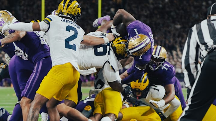Jonah Coleman dives for a go-ahead TD against Michigan.