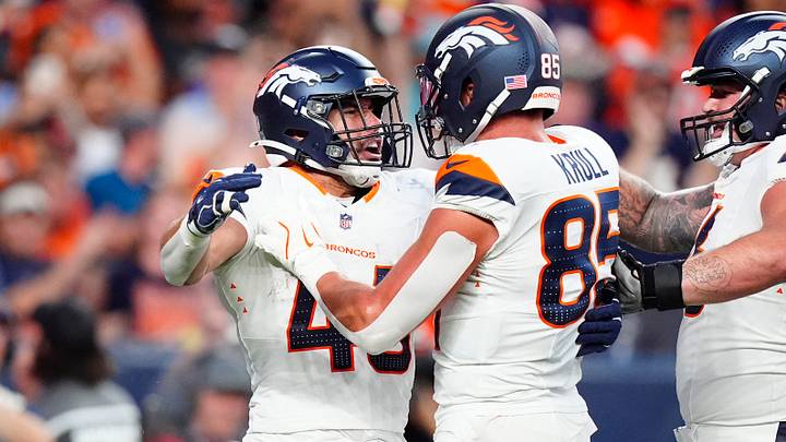 Denver Broncos fullback Adam Prentice (46) celebrates his touchdown carry with tight end Lucas Krull (85) in the first quarter during a preseason game against the Minnesota Vikings. Denver Broncos fullback Adam Prentice (46) celebrates his touchdown carry with tight end Lucas Krull (85) in the first quarter during a preseason game against the Minnesota Vikings.