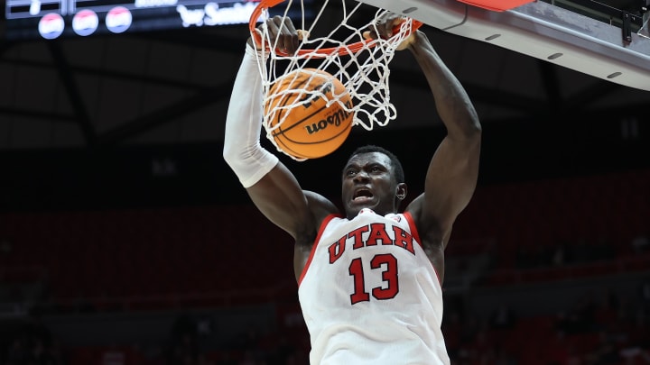 Jan 18, 2024; Salt Lake City, Utah, USA; Utah Utes center Keba Keita (13) dunks the ball against the Oregon State Beavers during the second half at Jon M. Huntsman Center. Mandatory Credit: Rob Gray-USA TODAY Sports