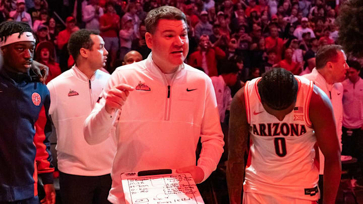 Dec 20, 2025; Phoenix, Arizona, USA; Arizona Wildcats head coach Tommy Lloyd against the San Diego State Aztecs during the Hall of Fame Series at Mortgage Matchup Center. Mandatory Credit: Mark J. Rebilas-Imagn Images