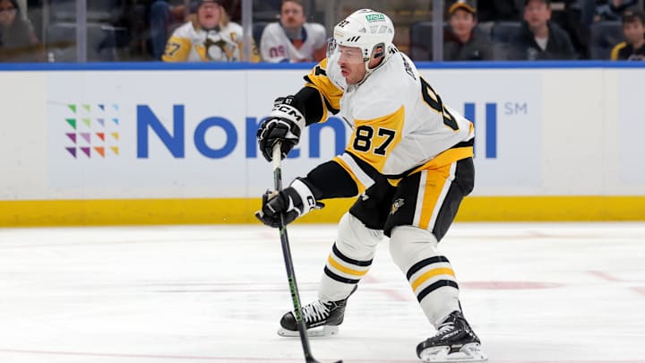 Feb 3, 2026; Elmont, New York, USA; Pittsburgh Penguins center Sidney Crosby (87) shoots the puck against the New York Islanders during the first period at UBS Arena. Mandatory Credit: Brad Penner-Imagn Images