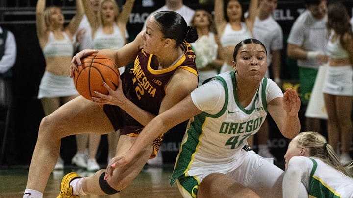 Minnesota’s Brylee Glenn, left, battles Oregon’s Avary Cain, center, and Mia Jacobs for a loose ball in the closing second of the game at Matthew Knight Arena in Eugene Jan. 21, 2026. Minnesota’s Brylee Glenn, left, battles Oregon’s Avary Cain, center, and Mia Jacobs for a loose ball in the closing second of the game at Matthew Knight Arena in Eugene Jan. 21, 2026.