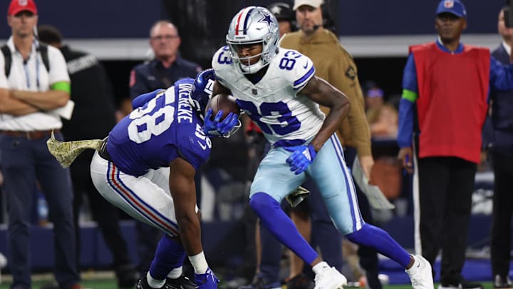 Nov 12, 2023; Arlington, Texas, USA;  Dallas Cowboys wide receiver Jalen Brooks (83) runs with the ball as New York Giants linebacker Bobby Okereke (58) defends during the second half at AT&T Stadium. 