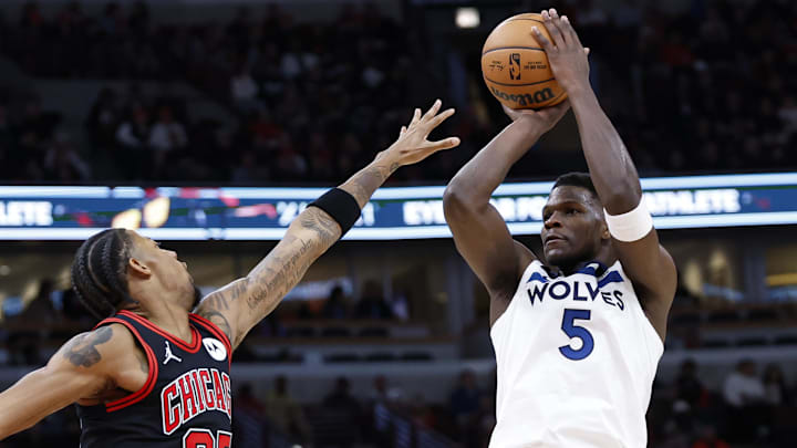 Nov 7, 2024; Chicago, Illinois, USA; Minnesota Timberwolves guard Anthony Edwards (5) shoots against Chicago Bulls forward Dalen Terry (25) during the first half at United Center. Nov 7, 2024; Chicago, Illinois, USA; Minnesota Timberwolves guard Anthony Edwards (5) shoots against Chicago Bulls forward Dalen Terry (25) during the first half at United Center.
