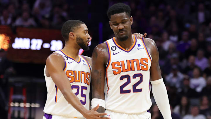 Phoenix Suns forward Mikal Bridges (25) talks with center Deandre Ayton. 