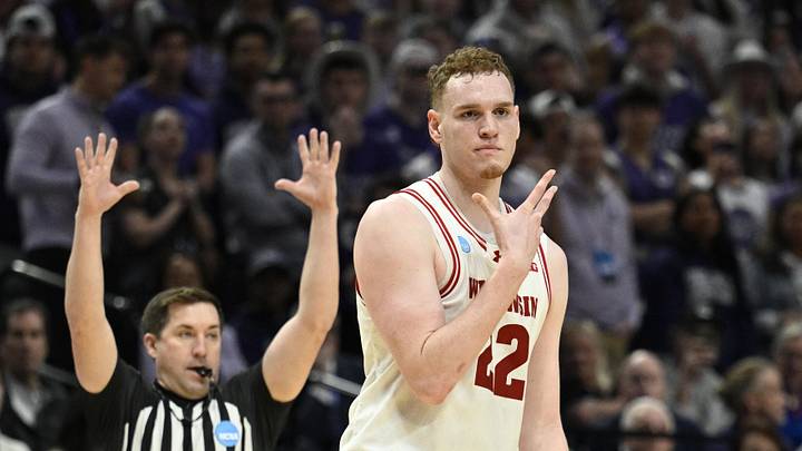 Mar 19, 2026; Portland, OR, USA; Wisconsin Badgers forward Austin Rapp (22) reacts during the second half of a first round game of the men's 2026 NCAA Tournament against the High Point Panthers at Moda Center. Mandatory Credit: Troy Wayrynen-Imagn Images