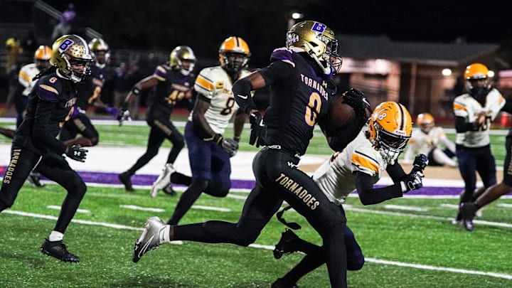 Booker's Chauncey Kennon runs upfield during the Class 3A-Region 3 Final against Boca Ciega in Sarasota on Friday, Nov. 29, 2024. Booker won 41-6. Booker's Chauncey Kennon runs upfield during the Class 3A-Region 3 Final against Boca Ciega in Sarasota on Friday, Nov. 29, 2024. Booker won 41-6.