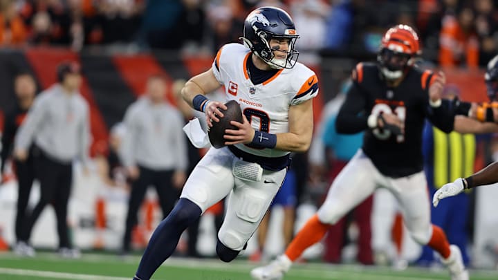 Dec 28, 2024; Cincinnati, Ohio, USA;  Denver Broncos quarterback Bo Nix (10) looks downfield during the first quarter against the Cincinnati Bengals at Paycor Stadium.