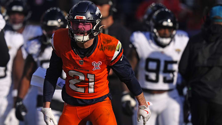 Dec 21, 2025; Denver, Colorado, USA; Denver Broncos cornerback Riley Moss (21) reacts against the Jacksonville Jaguars during the first half  at Empower Field at Mile High. Mandatory Credit: Ron Chenoy-Imagn Images