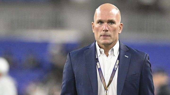 Nov 7, 2024; Baltimore, Maryland, USA;  Baltimore Ravens general manager Eric Decosta one the field before the game against the Cincinnati Bengals at M&T Bank Stadium. Mandatory Credit: Tommy Gilligan-Imagn Images