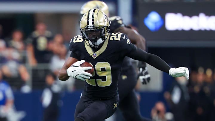 Sep 15, 2024; Arlington, Texas, USA;  New Orleans Saints cornerback Paulson Adebo (29) intercepts a ball intended for Dallas Cowboys wide receiver Jalen Brooks (not pictured) during the first half at AT&T Stadium. Mandatory Credit: Kevin Jairaj-Imagn Images