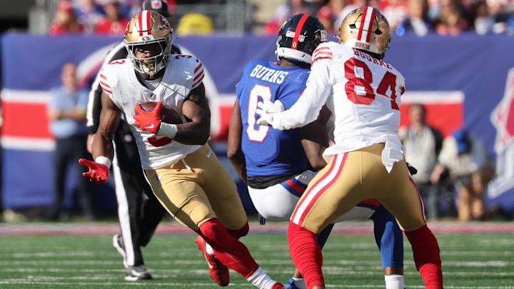 Nov 2, 2025; East Rutherford, New Jersey, USA; San Francisco 49ers running back Brian Robinson Jr. (3) carries the ball against the New York Giants during the first half at MetLife Stadium. Mandatory Credit: Ed Mulholland-Imagn Images