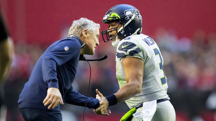 Jan 9, 2022; Glendale, Arizona, USA; Seattle Seahawks quarterback Russell Wilson (3) celebrates a touchdown with head coach Pete Carroll against the Arizona Cardinals in the first half at State Farm Stadium. Mandatory Credit: Mark J. Rebilas-Imagn Images