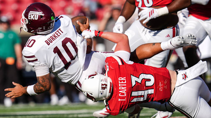 Louisville Cardinals linebacker Trent Carter (43) tackles Eastern Kentucky Colonels quarterback Myles Burkett (10) at the Cardinals' season opener Saturday, August 30, 2025 at L&N Federal Credit Union Stadium in Louisville, Kentucky. Louisville Cardinals linebacker Trent Carter (43) tackles Eastern Kentucky Colonels quarterback Myles Burkett (10) at the Cardinals' season opener Saturday, August 30, 2025 at L&N Federal Credit Union Stadium in Louisville, Kentucky.