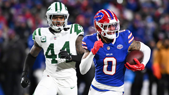 Buffalo Bills wide receiver Keon Coleman (0) carries the ball after a reception defended by New York Jets linebacker Jamien Sherwood (44) during the third quarter at Highmark Stadium.