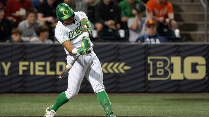 Oregon infielder Naulivou Lauaki Jr. hits a home run to tie the game in the ninth inning as the Oregon Ducks host the USC Trojans on May 14, 2026, in Eugene, Oregon.