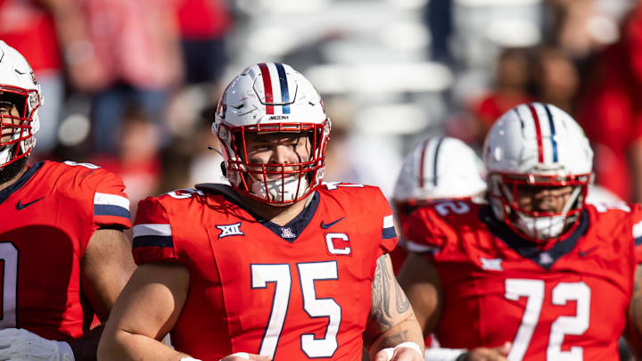 Oct 19, 2024; Tucson, Arizona, USA; Arizona Wildcats offensive lineman Josh Baker (75) against the Colorado Buffalos at Arizona Stadium. Mandatory Credit: Mark J. Rebilas-Imagn Images