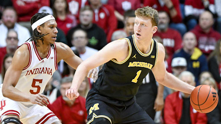 Feb 8, 2025; Bloomington, Indiana, USA; Michigan Wolverines center Danny Wolf (1) goes to the basket against Indiana Hoosiers forward Malik Reneau (5) during the first half at Simon Skjodt Assembly Hall.