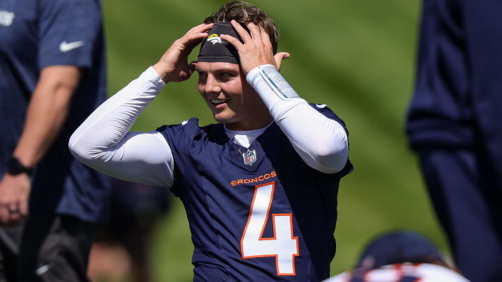 May 23, 2024; Englewood, CO, USA; Denver Broncos quarterback Zach Wilson (4) during organized team activities at Centura Health Training Center. Mandatory Credit: Isaiah J. Downing-USA TODAY Sports