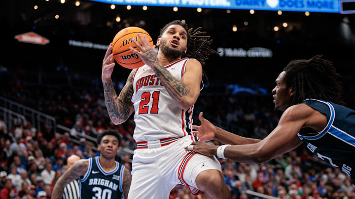 Mar 12, 2026; Kansas City, MO, USA; Houston Cougars guard Emanuel Sharp (21) rebounds during the second half against the BYU Cougars at T-Mobile Center. Mandatory Credit: William Purnell-Imagn Images