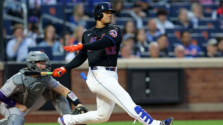 May 30, 2025; New York City, New York, USA; New York Mets right fielder Juan Soto (22) follows through on an RBI double against the Colorado Rockies during the third inning at Citi Field. Mandatory Credit: Brad Penner-Imagn Images