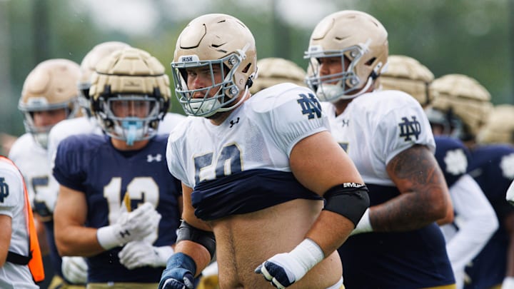 Notre Dame offensive lineman Rocco Spindler (50) runs to a drill during a Notre Dame football practice at Irish Athletic Center on Tuesday, Aug. 6, 2024, in South Bend.