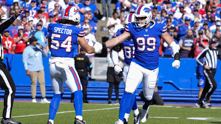Oct 20, 2024; Orchard Park, New York, USA; Buffalo Bills defensive end Casey Toohill (99) congratulates Buffalo Bills linebacker Baylon Spector (54) for making a defensive play against the Tennessee Titans during the first half at Highmark Stadium.