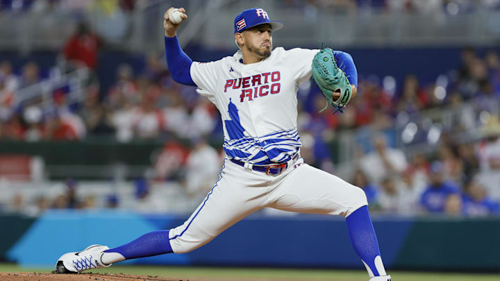 Mar 13, 2023; Miami, Florida, USA; Puerto Rico starting pitcher pitcher Jose De Leon (87) delivers a pitch during the first inning against Israel at LoanDepot Park. Mandatory Credit: Sam Navarro-Imagn Images