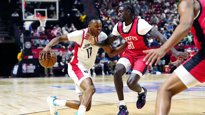 Jul 14, 2024; Las Vegas, NV, USA; Washington Wizards guard Bub Carrington (17) dribbles against Houston Rockets guard Kira Lewis Jr (60) during the first quarter at Thomas & Mack Center. Mandatory Credit: Stephen R. Sylvanie-Imagn Images Jul 14, 2024; Las Vegas, NV, USA; Washington Wizards guard Bub Carrington (17) dribbles against Houston Rockets guard Kira Lewis Jr (60) during the first quarter at Thomas & Mack Center. Mandatory Credit: Stephen R. Sylvanie-Imagn Images