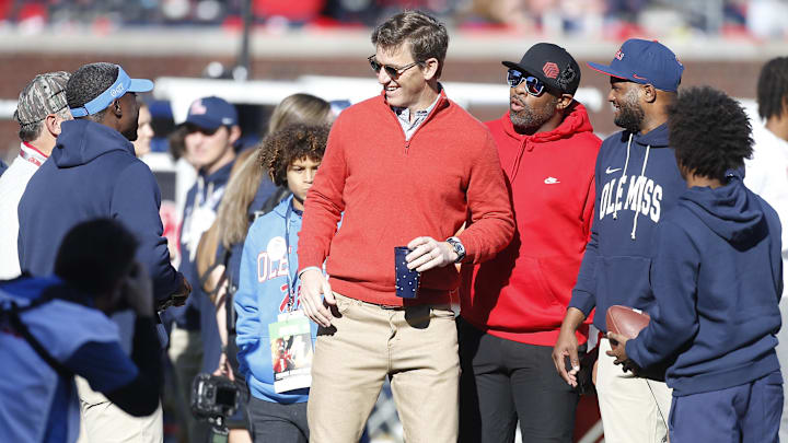 Dec 20, 2025; Oxford, MS, USA; Eli Manning former Mississippi Rebels quarterback and NFL star visits the field prior to a game against the Tulane Green Wave at Vaught-Hemingway Stadium. Mandatory Credit: Petre Thomas-Imagn Images