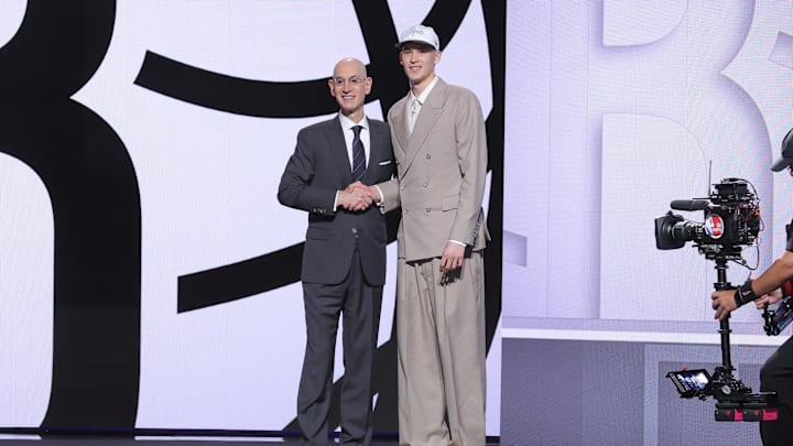 Jun 25, 2025; Brooklyn, NY, USA;  Egor Demin stands with NBA commissioner Adam Silver after being selected as the eighth pick by the Brooklyn Nets in the first round of the 2025 NBA Draft at Barclays Center. Mandatory Credit: Brad Penner-Imagn Images