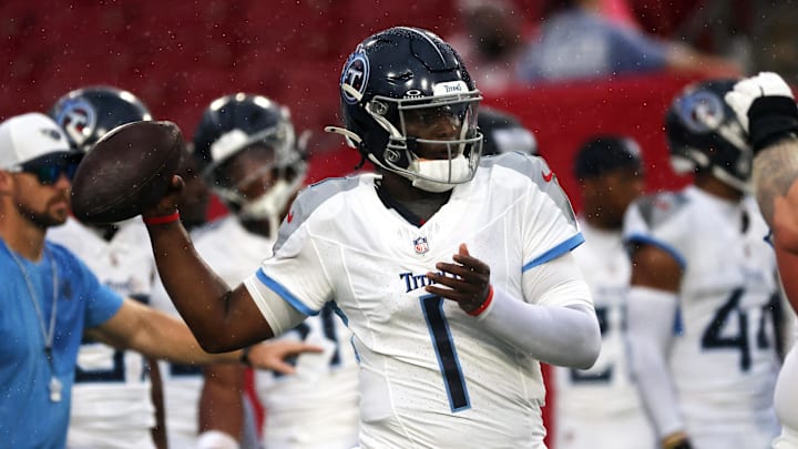 Aug 9, 2025; Tampa, Florida, USA; Tennessee Titians quarterback Cam Ward (1) works out prior to the game against the Tampa Bay Buccaneers at Raymond James Stadium. Mandatory Credit: Kim Klement Neitzel-Imagn Images