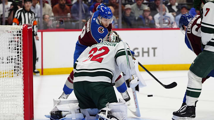 May 5, 2026; Denver, Colorado, USA; Minnesota Wild goaltender Filip Gustavsson (32) defends on Colorado Avalanche center Nathan MacKinnon (29) during the second period in game two of the second round of the 2026 Stanley Cup Playoffs at Ball Arena. Mandatory Credit: Ron Chenoy-Imagn Images