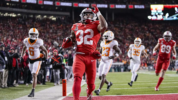 Ohio State Buckeyes running back TreVeyon Henderson (32) runs for a touchdown during the first half of the College Football Playoff first round game against the Tennessee Volunteers at Ohio Stadium in Columbus on Dec. 21, 2024. Ohio State Buckeyes running back TreVeyon Henderson (32) runs for a touchdown during the first half of the College Football Playoff first round game against the Tennessee Volunteers at Ohio Stadium in Columbus on Dec. 21, 2024.
