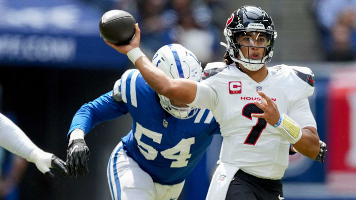 Indianapolis Colts defensive end Dayo Odeyingbo (54) moves in to tackle Houston Texans quarterback C.J. Stroud (7) on Sunday, Sept. 8, 2024, during a game against the Houston Texans at Lucas Oil Stadium in Indianapolis.