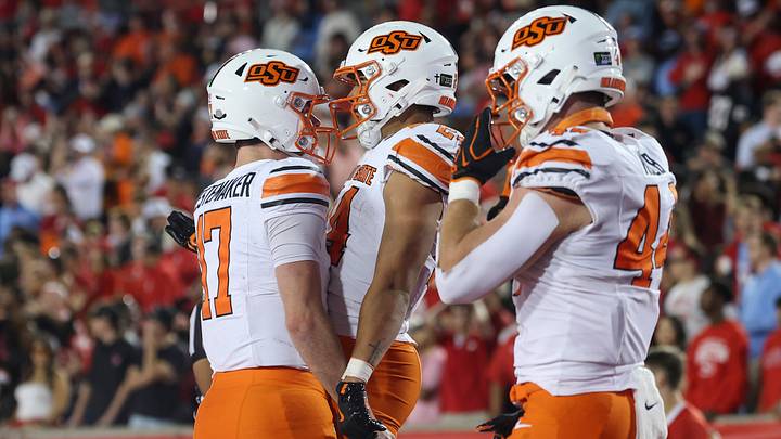 Oklahoma State Cowboys quarterback Drew Mestemaker (17) celebrates with running back Caleb Hawkins. Oklahoma State Cowboys quarterback Drew Mestemaker (17) celebrates with running back Caleb Hawkins.