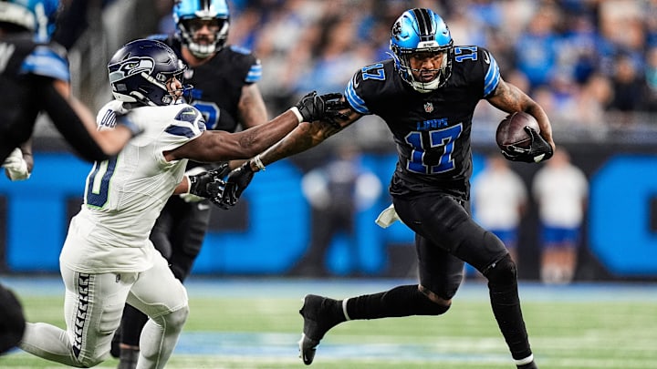 Detroit Lions wide receiver Tim Patrick (17) runs for a first down against Seattle Seahawks linebacker Tyrel Dodson (0) during the second half at Ford Field in Detroit on Monday, Sept. 30, 2024.