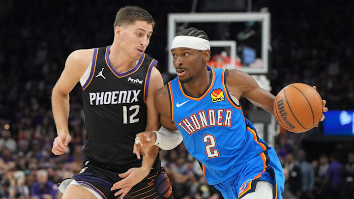 Apr 25, 2026; Phoenix, Arizona, USA; Oklahoma City Thunder guard Shai Gilgeous-Alexander (2) drives on Phoenix Suns guard Collin Gillespie (12) in the first half during game three of the first round of the 2026 NBA Playoffs at Mortgage Matchup Center. Mandatory Credit: Rick Scuteri-Imagn Images