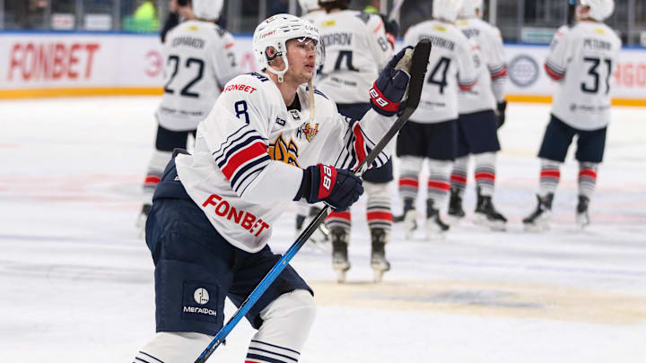 Roman Kantserov (8) of Metallurg Hockey Club seen in action...